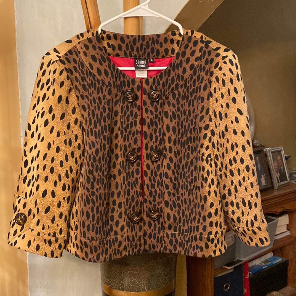 Design by Sharon Young. Polyester, rayon, spandex.Animal print
